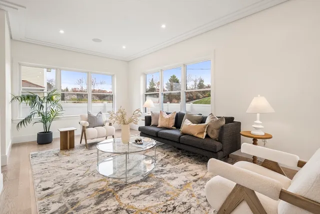 a living room with furniture and a table