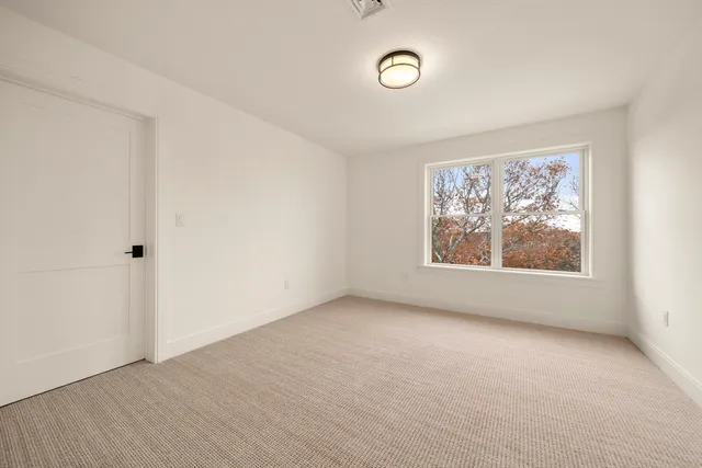a bathroom with a double vanity sink toilet and shower
