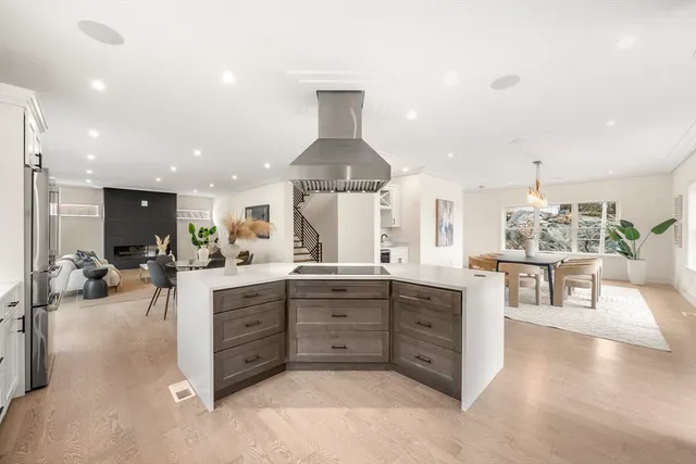 a kitchen with stainless steel appliances granite countertop a refrigerator sink and cabinets