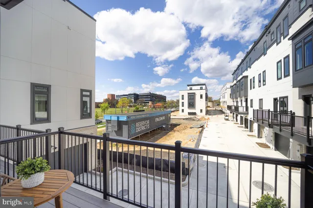 a view of a chairs and tables in the balcony