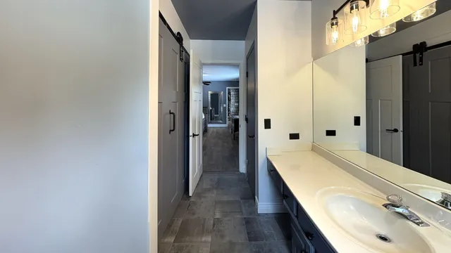 a bathroom with a tub and shower