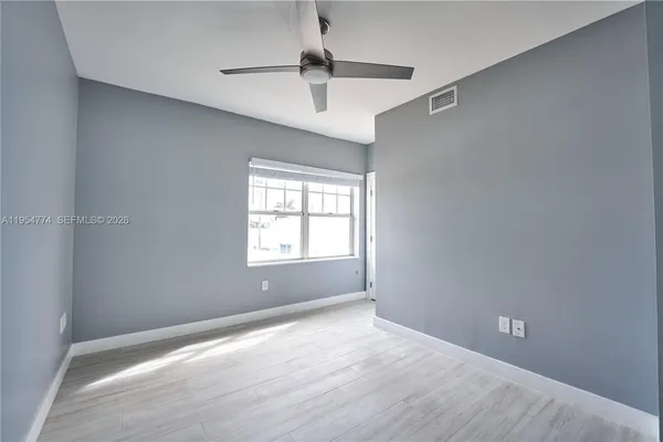 a view of an empty room with a window