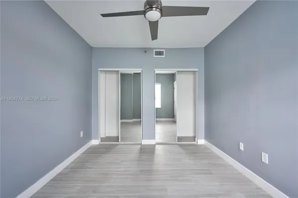 a view of an empty room and window