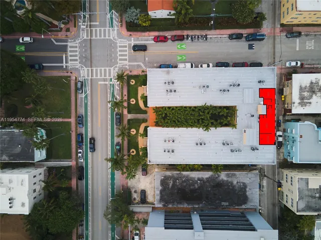 a buildings covered with tall trees