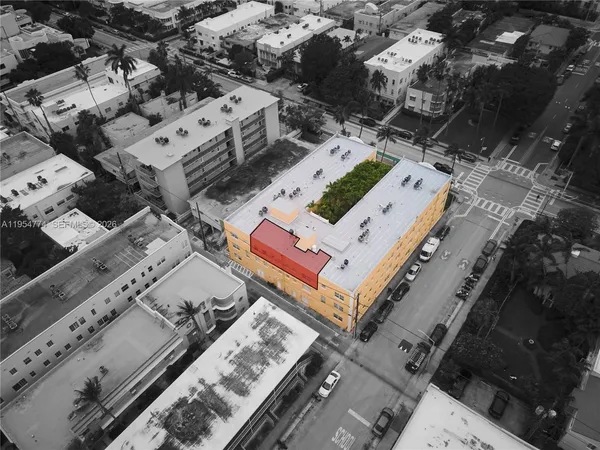 an aerial view of a house with a large window