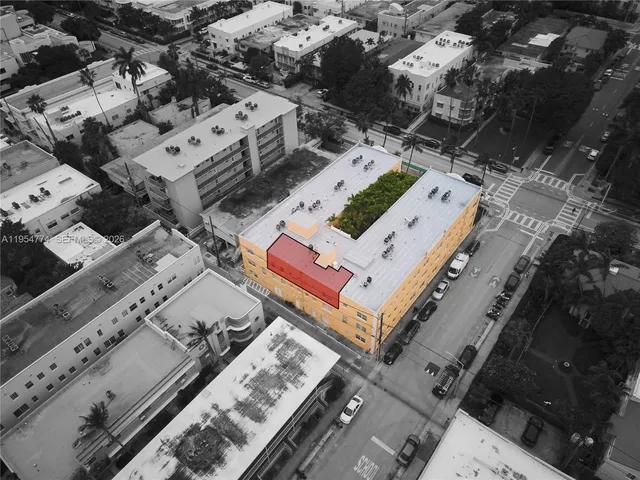 an aerial view of a house with a large window