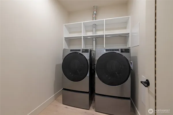 a utility room with dryer and washer
