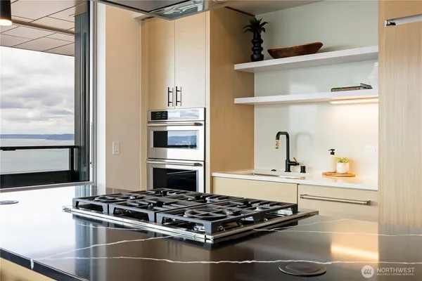 a kitchen with a stove and a refrigerator