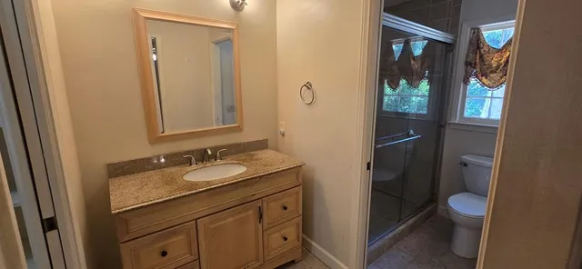 an empty room with wooden floor and closet