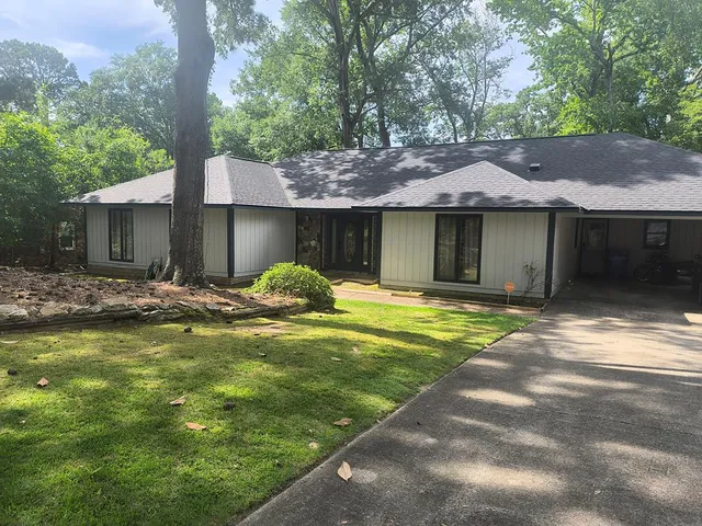 a front view of a house with swimming pool