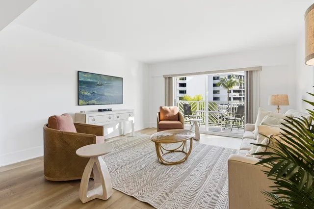 a kitchen with a sink cabinets and wooden floor