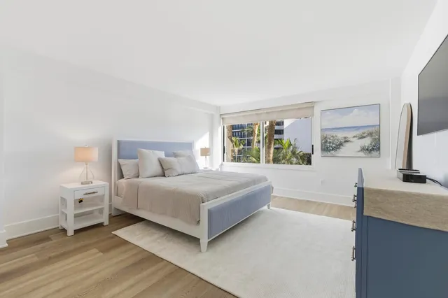 a view of a swimming pool and lounge chair