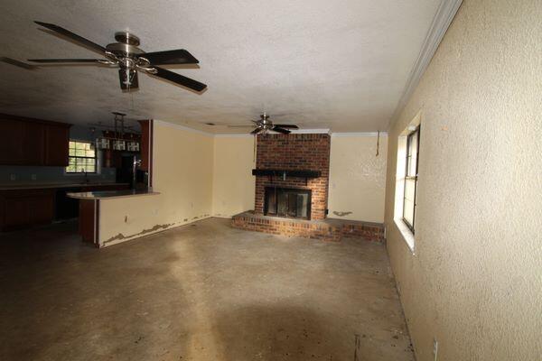 6047 Eden Square Crestview, FL 32539 - Photo 9 of 39 en empty room with windows and ceiling fan