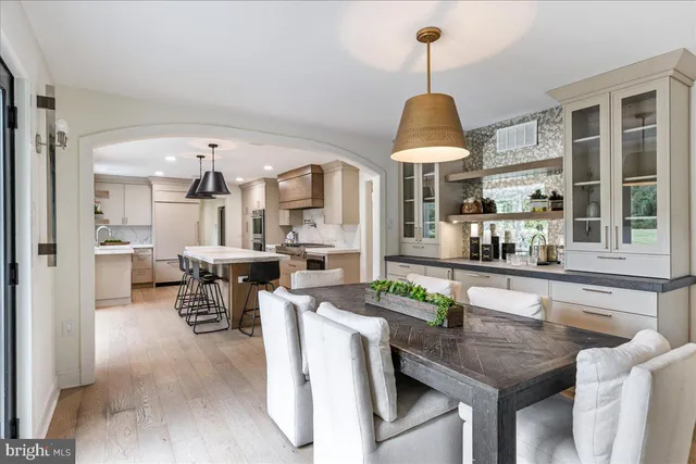 a kitchen with stainless steel appliances granite countertop a stove and a refrigerator