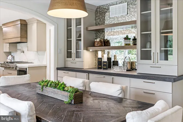a kitchen with stainless steel appliances granite countertop a stove and a refrigerator