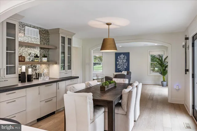 a kitchen with a table and chairs