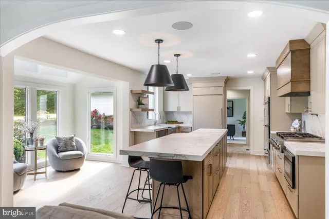 a kitchen with stainless steel appliances a stove a microwave and a refrigerator