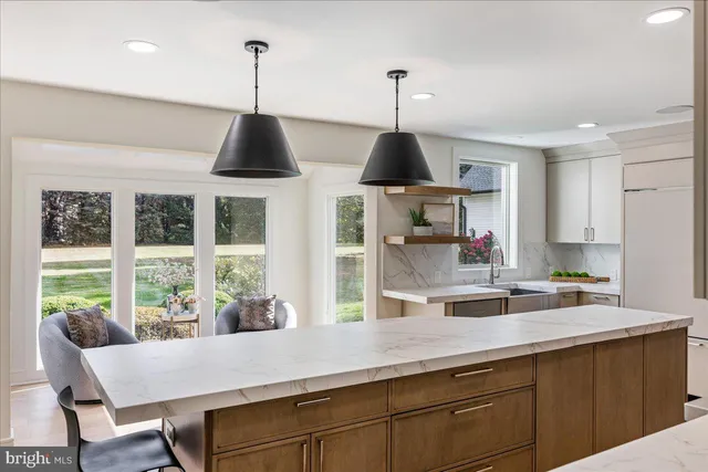 a spacious bedroom with a large bed and a window