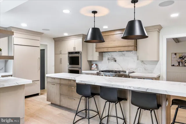 a bedroom with a large bed and a dresser