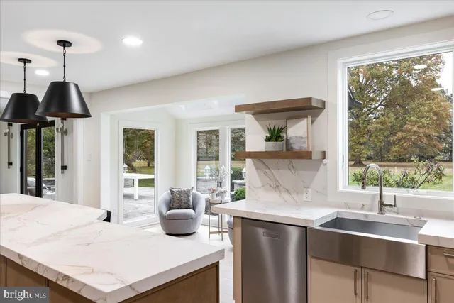 a bathroom with a double vanity sink a mirror and shower