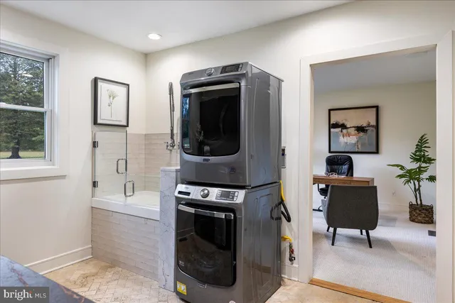 a bathroom with a granite countertop sink a toilet and a mirror