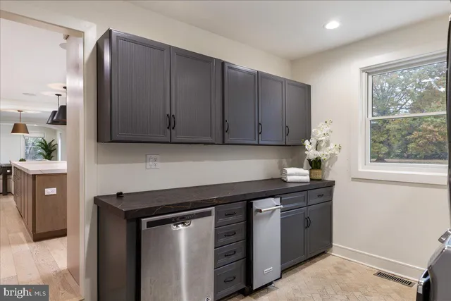a spacious bedroom with a bed and a window