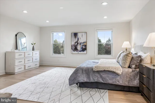 a view of a livingroom with furniture and hardwood floor