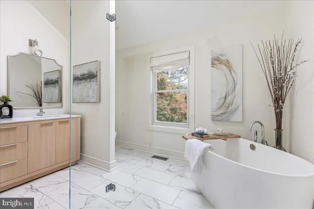 a view of a swimming pool with an outdoor space and seating area