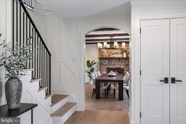 a view of a dining room with furniture and chandelier