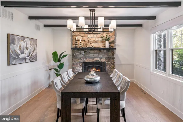a dining room with furniture and window