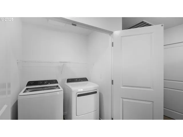 a kitchen with a refrigerator and a stove