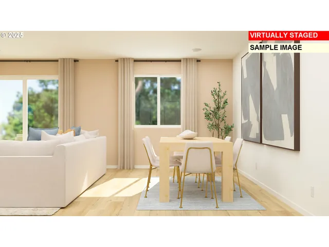 a dining room with furniture and a large window