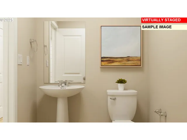 a bathroom with a sink mirror and toilet