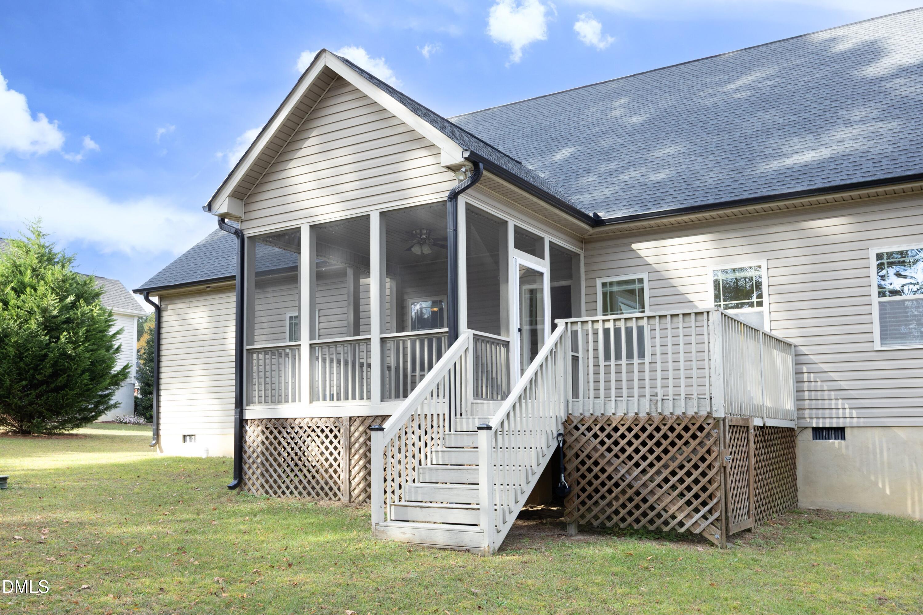 6120 Catandpolly Lane Raleigh, NC 27603 - Photo 4 of 36 a front view of a house with a garden