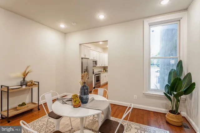 a view of a workspace with furniture and a potted plant