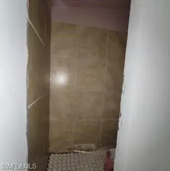 a kitchen with a refrigerator a stove a washer and dryer