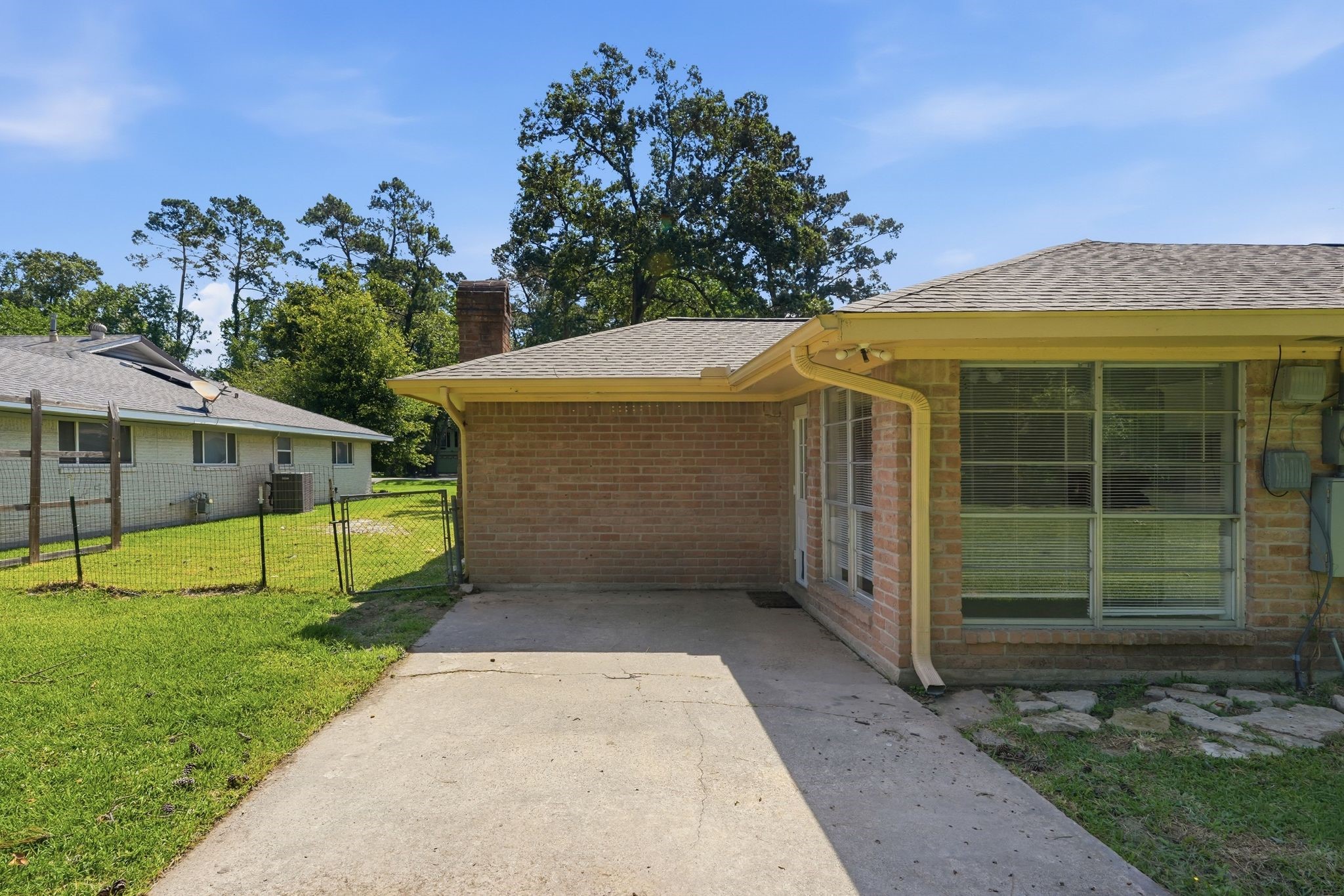 25611 Timberlane Drive Spring, TX 77386 - Photo 31 of 38 a view of a house with a backyard and garden