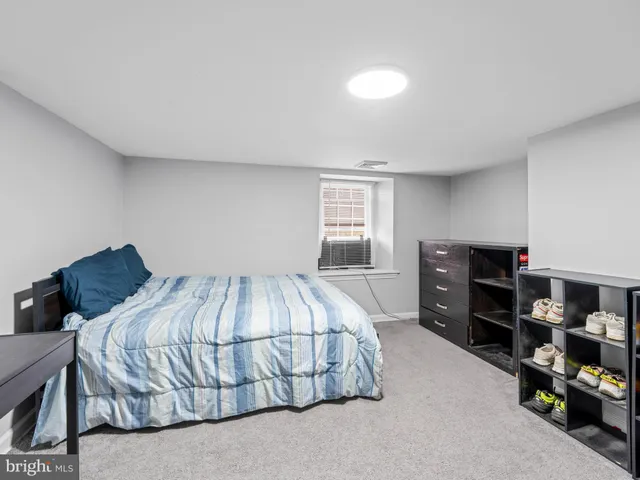 a bedroom with a bed and a cabinets