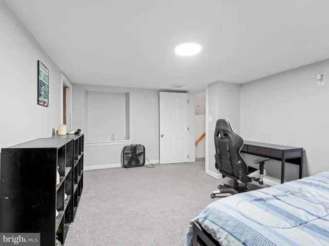 a bathroom with a sink toilet and a mirror