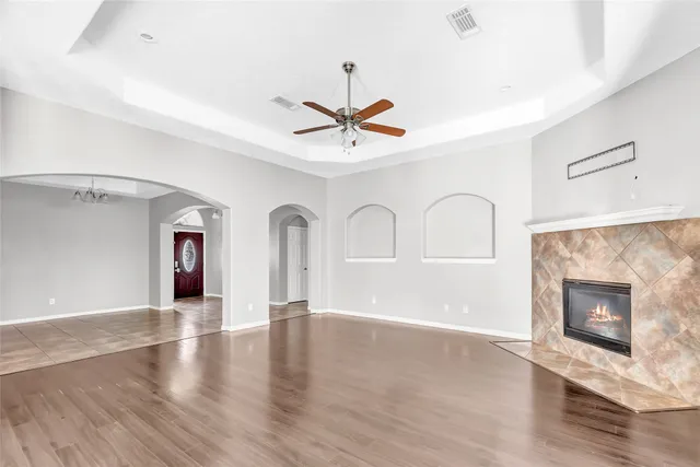a living room with furniture and a fireplace