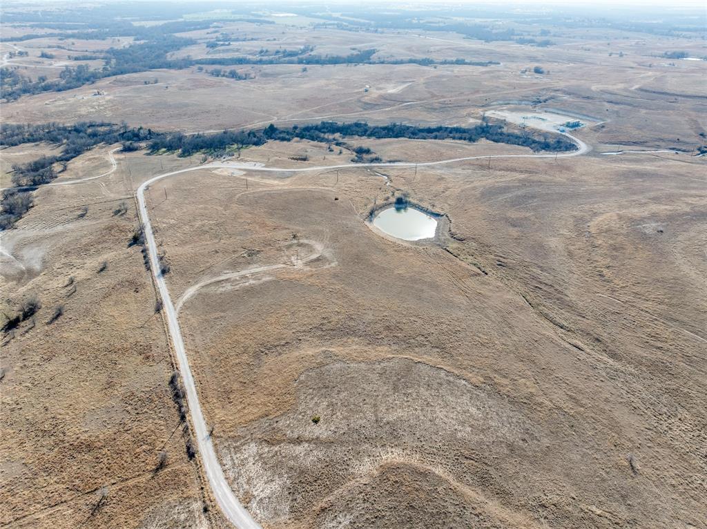287 Hwy S Rhome Tx 76078 Highway South Rhome, TX 76078 - Photo 12 of 13 a view of a dry yard with wooden floor