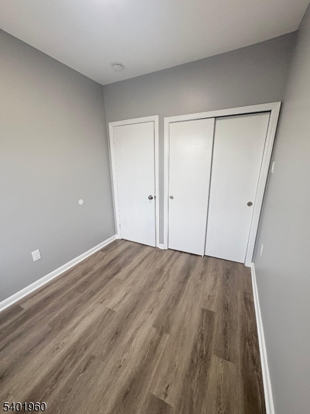 37 Mercer Street, Unit 4 Wallington, NJ 07057 - Photo 8 of 11 a view of an empty room with wooden floor