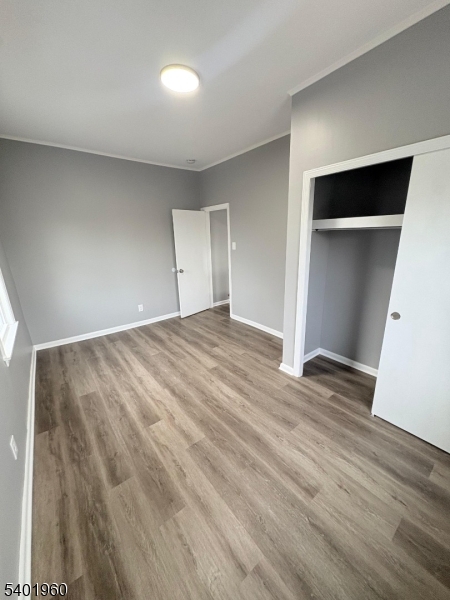 37 Mercer Street, Unit 4 Wallington, NJ 07057 - Photo 10 of 11 a view of empty room with wooden floor