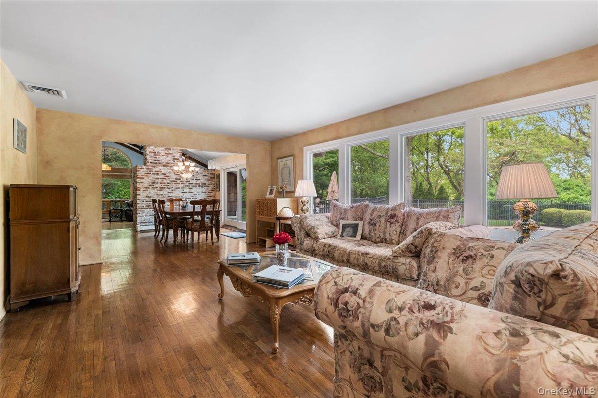 6 Apex Road Melville, NY 11747 - Photo 3 of 50 a living room with furniture and a large window