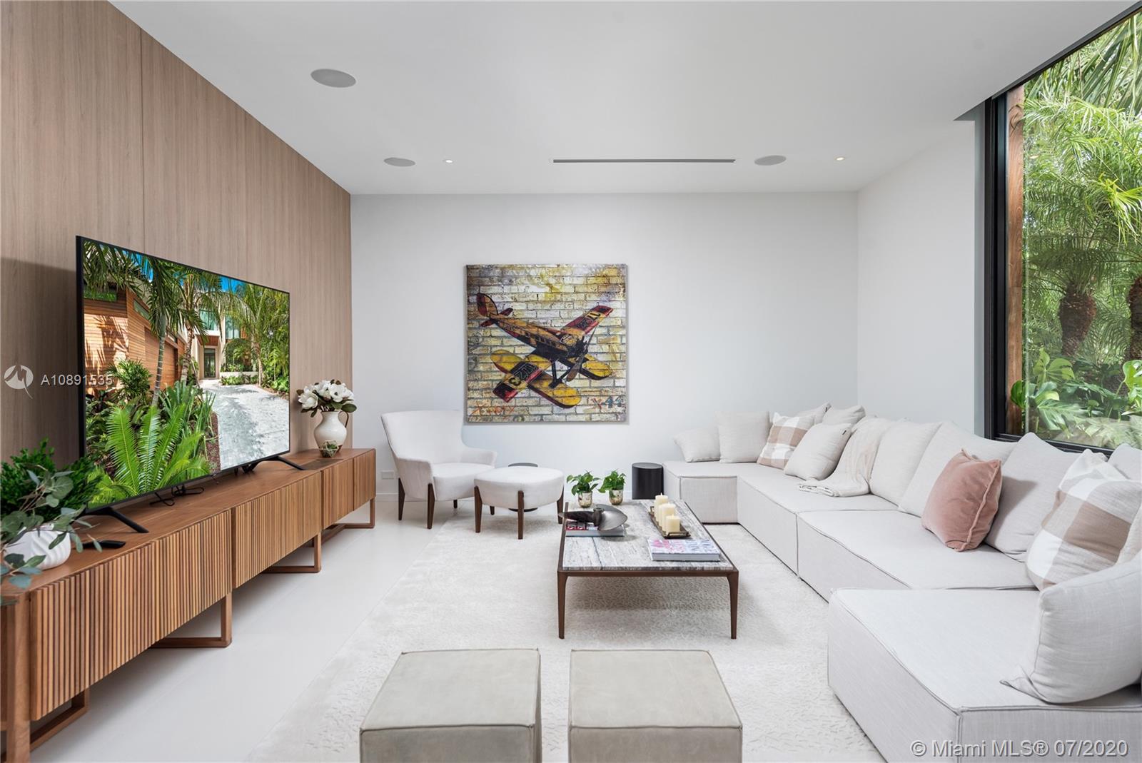 Sunset Islands Miami Beach, FL 33140 - Photo 11 of 72 a living room with furniture and a flat screen tv