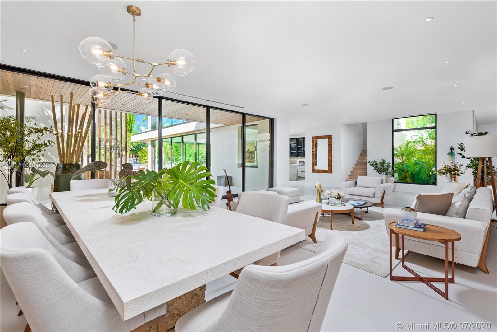 Sunset Islands Miami Beach, FL 33140 - Photo 14 of 72 a living room with furniture large window and a chandelier