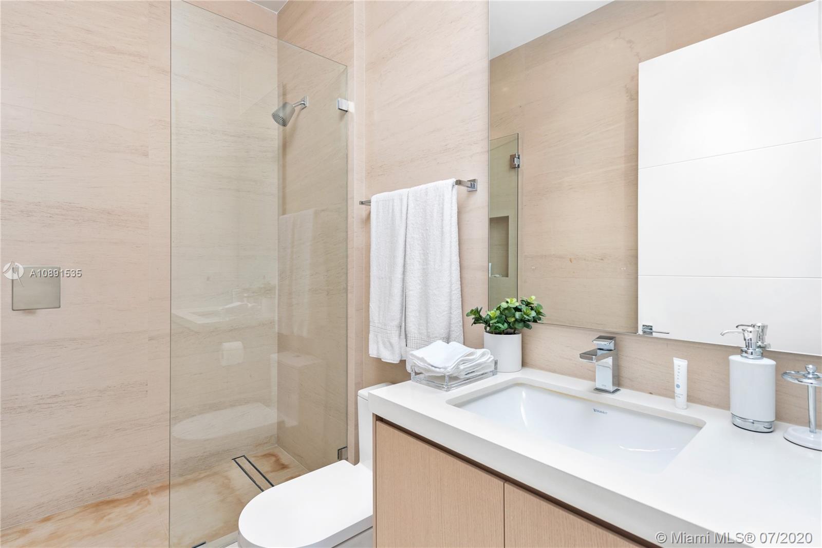 Sunset Islands Miami Beach, FL 33140 - Photo 16 of 72 a bathroom with a sink toilet and shower