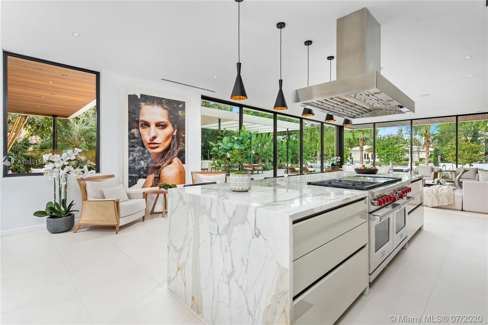 Sunset Islands Miami Beach, FL 33140 - Photo 19 of 72 a kitchen with stainless steel appliances kitchen island a large window in it
