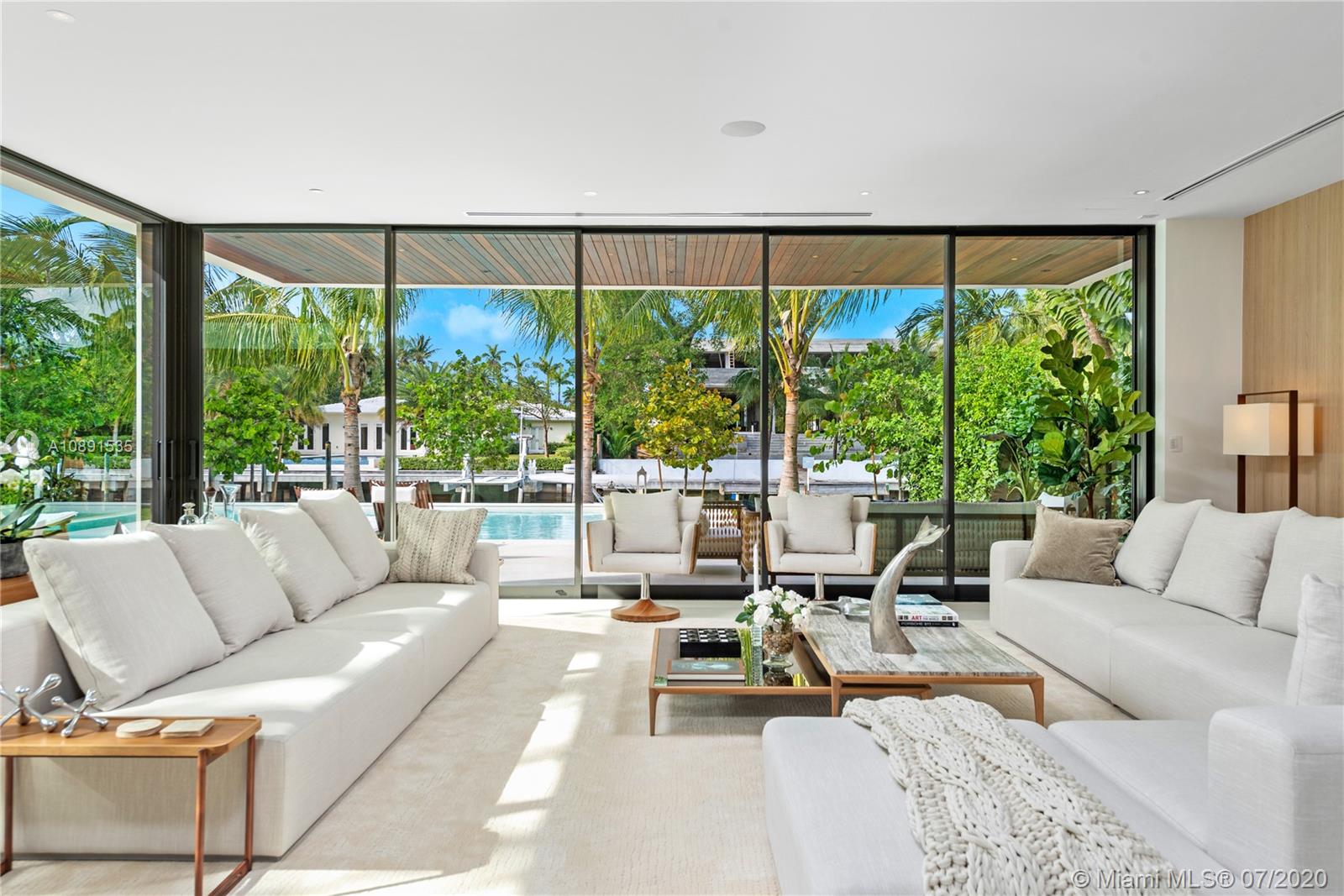 Sunset Islands Miami Beach, FL 33140 - Photo 20 of 72 a living room with furniture and a large window