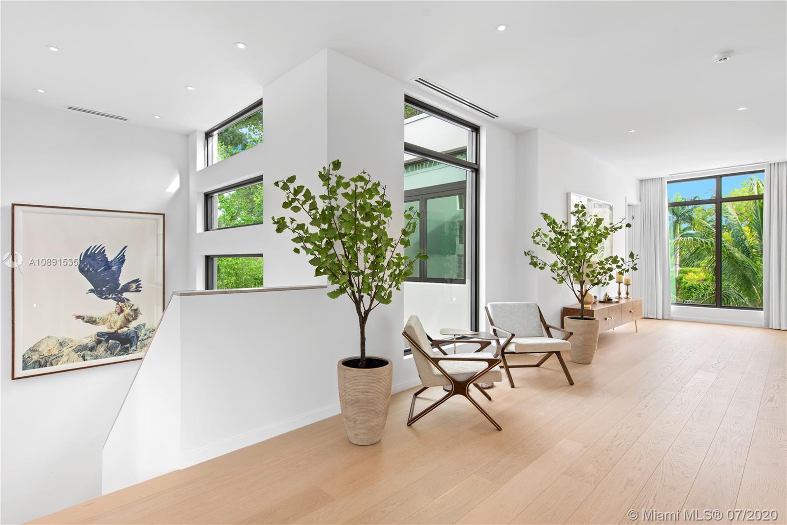 Sunset Islands Miami Beach, FL 33140 - Photo 24 of 72 a living room with furniture and a potted plant